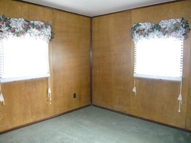 Second bedroom with two large windows and newer ca