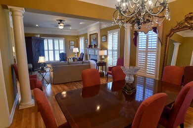 Another view of the living and dining spaces empha