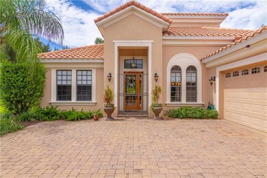 Lovely gated entry way sets the stage for this stunning home.