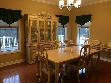 Dining Room. The perfectly maintained hardwoods fl