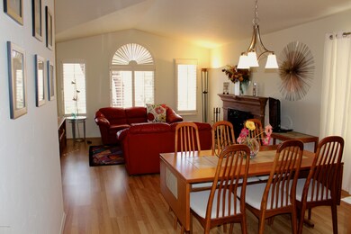 Living room w/shutters and formal dining