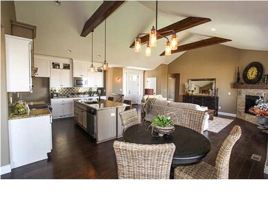 Living area with 3 hand hewn box beams
