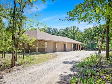 Oversized 3 car garage with pull down stairs to access floored walk-in storage area.