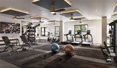 Exercise room with ceiling fan and a wealth of nat