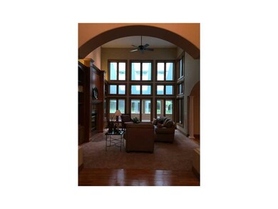 Family Room-L1. With a wall of windows and new car