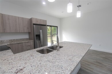 Kitchen featuring a sink, stainless steel fridge w