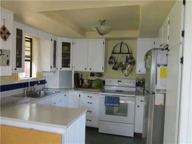 Tidy kitchen. Stainless sink. Nice counter space.