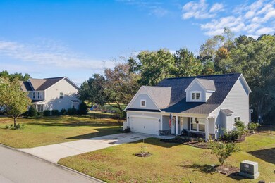 New england style home featuring a front lawn and 