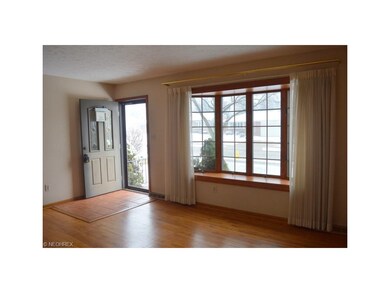 Spacious living room with hardwood floor