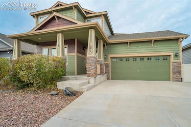 Front Exterior, Angled Right – Side-angle perspective highlighting the attached two-car garage, stone accents, and clean concrete driveway.