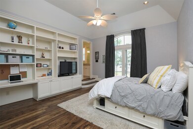 Another secondary bedroom with wood floors