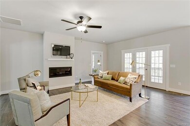 Family Room has Triple Atrium Door Leading to Deck