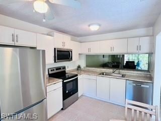 Kitchen with appliances with stainless steel finis