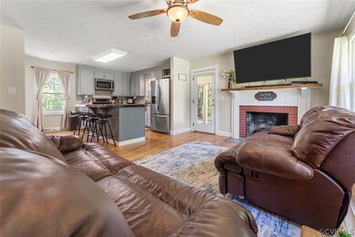 Great Room - hardwood flrs.,manteled brick Firepla
