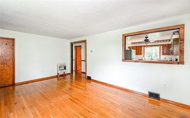 Living room showing view of kitchen