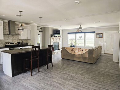 Kitchen featuring stainless steel range with elec