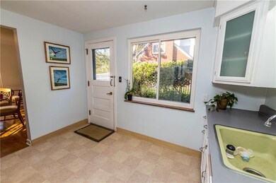 Walk-out from kitchen to concrete patio.
