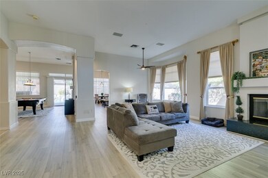 Living area featuring light wood-style floors, vis