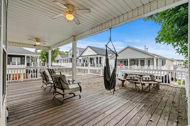 Wooden deck featuring ceiling fan