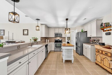 Kitchen with pendant lighting, stainless steel app
