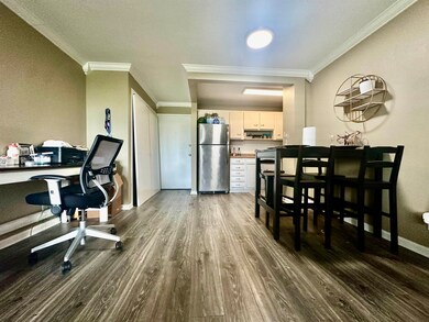 Office area featuring ornamental molding, a textur
