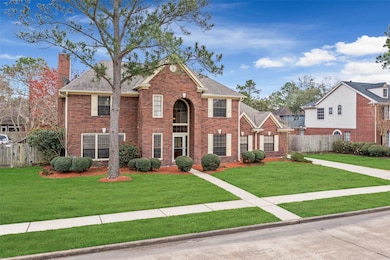 This two-story, three-bedroom home features a classic brick elevation, ivory shutters, stone accents, and extended walkway.