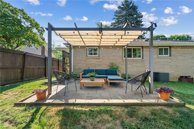 Cute patio with newer Pergola.