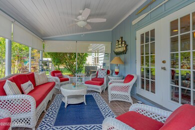 Screen Porch Overlooks Fenced Backyard