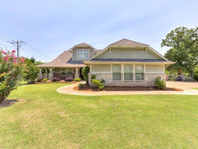 Craftsman-style home featuring a front lawn