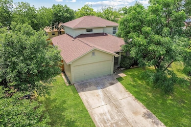 View of front of house featuring driveway, a gara
