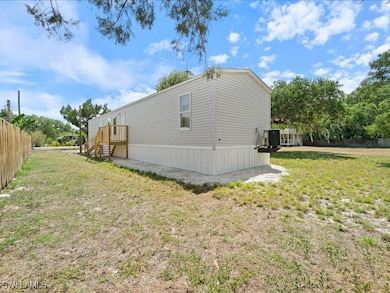 View of property exterior featuring central AC, fe