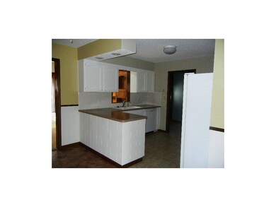 Bright kitchen has plenty of counter space and cup
