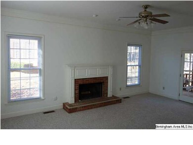 den with cozy fireplace