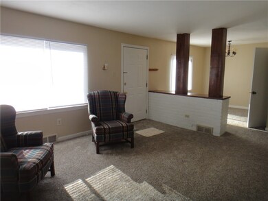 living room open to dining area