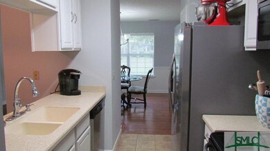 Kitchen with has corian counters, updated cabinets