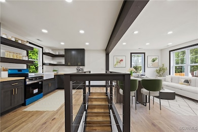 Kitchen featuring stainless steel electric range o
