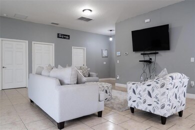 Main living area. Doors from left to right Owner's suite, laundry room, garage, front door (unseen).