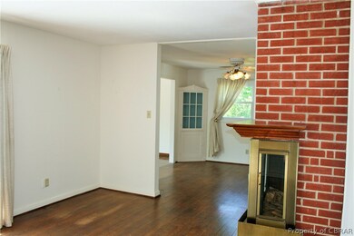 Living room includes a wood-burning fireplace.