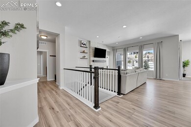 Hallway featuring laminate flooring