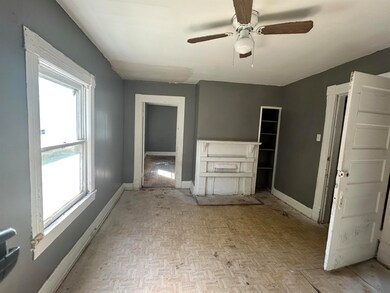 Bathroom with baseboards and a ceiling fan