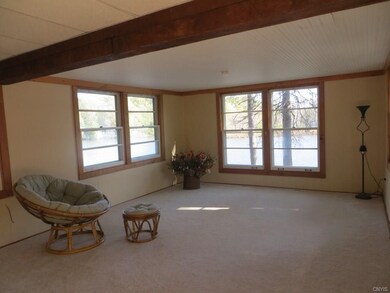 LIVING ROOM WITH RIVERVIEWS FROM ALL WINDOWS