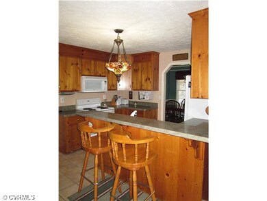 Kitchen eat-off bar.  Tile flooring.