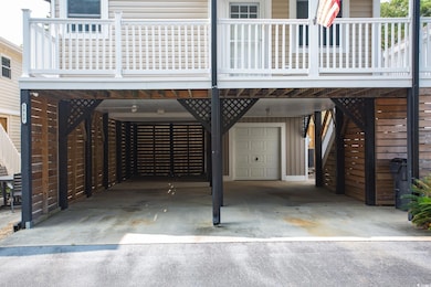 View of parking with a carport