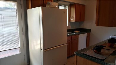 The kitchen has lots of counter top and storage sp