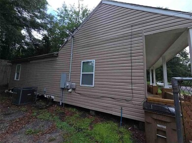 View of property exterior featuring a cooling unit
