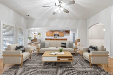 Oversized family room.. wall of  windows overlooking park like backyard