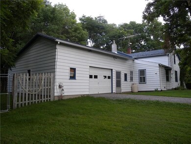 The garage has space for the car and a significant