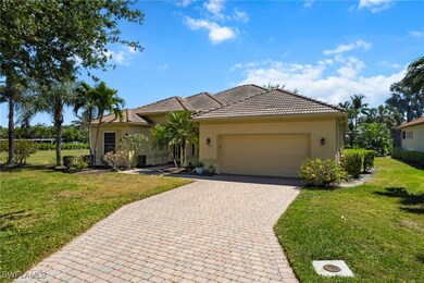 View of front of house with decorative driveway, a