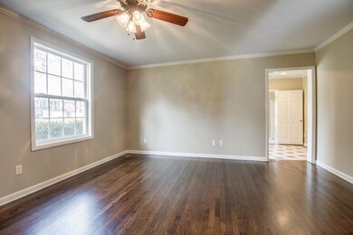 A view across the living room, where there's a great place to mount your flatscreen television or hang your favorite piece of art.