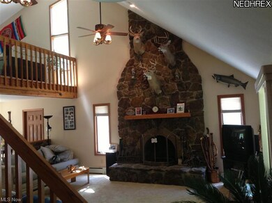 Beautiful custom stone fireplace goes from floor t